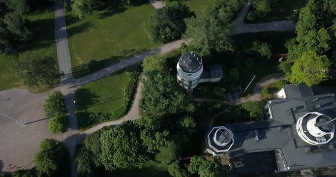 4K summer day aerial video of Helsinki Kaivopuisto central park with Observatory, ctyscape view, park woods area around it, in capital of Finland Suomi, northern Europe