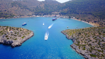 Obraz premium Aerial bird's eye view photo taken by drone from bay and iconic Monastery of Panormitis, Symi island, Dodecanese, Greece