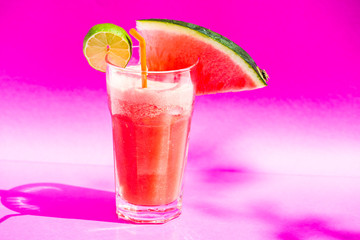 watermelon smoothie on pink background