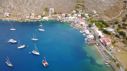 Aerial bird's eye view photo taken by drone of famous natural bay of Pedi, Symi island, Dodecanese, Greece
