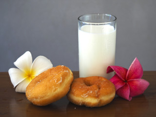 Bakery and milk ..Homemade donuts sprinkled with powdered sugar