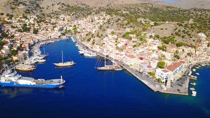 Fototapeta premium Aerial brid's eye photo taken by drone of Yalos, iconic port of Symi island, Dodecanese, Greece