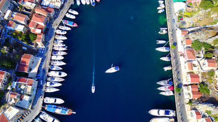 Fototapeta na wymiar Aerial brid's eye photo taken by drone of Yalos, iconic port of Symi island, Dodecanese, Greece