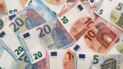 Euro cash background. Many Euro banknotes of different values.