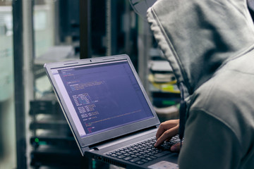 Hacker Breaking into Corporate Data Servers. Place Has Dark Atmosphere