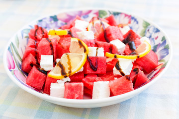 salad with watermelon, feta cheese, lemon and balsamic sauce