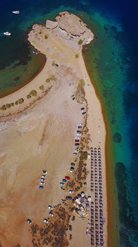 Aerial birds eye view photo taken by drone of famous rock of Kalikatsou in Petra beach, Patmos island, Dodecanese, Greece