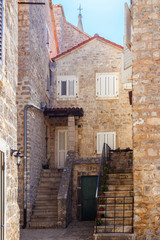 Old historical buildings in the narrow street at ancient city Budva, Montenegro