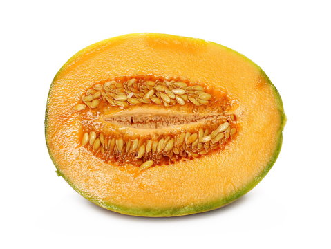 Fresh cantaloupe melon sliced in half isolated on white background