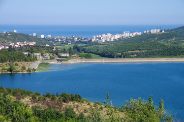 Fototapeta na wymiar View of the city of Alushta from the shore of the reservoir, Crimea