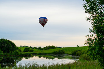 Bright colorful hot air balloon blue clear sky © smspsy