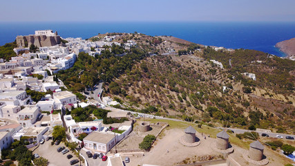 Aerial bird's eye view photo taken by drone of iconic windmills in Chora of Patmos island, Greece