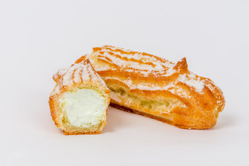Two eclairs on a white background