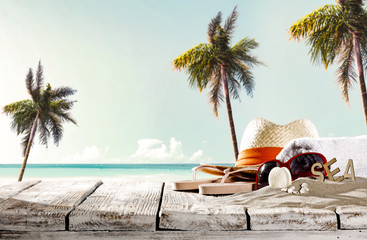 Summer background of desk and beach with palms. Free space for your decoration. 