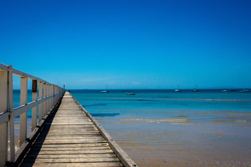 Obraz premium wooden pier on a beach seascape
