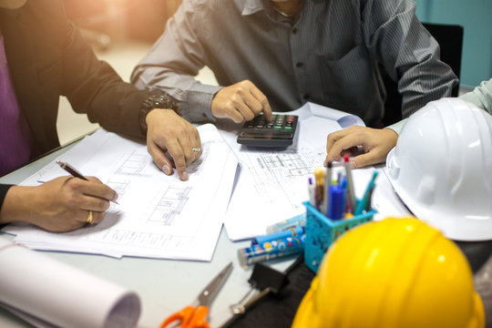 Concept Agreement between the employer and architect Nick and desk of Architectural project in construction site or office building  and Building models