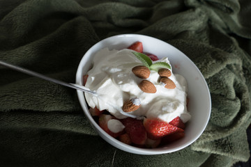 strawberries with whipped cream in a bowl