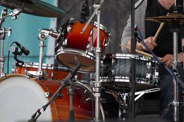 Fototapeta na wymiar The musician plays the drums