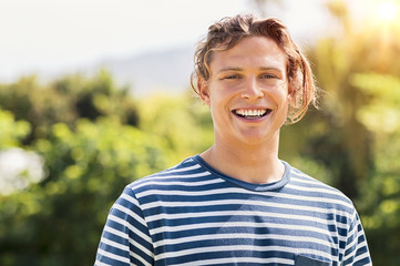 Smiling blonde guy outdoor
