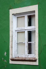 Old broken window in the wall