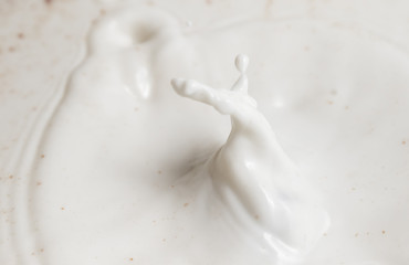 Chocolate falls in milk