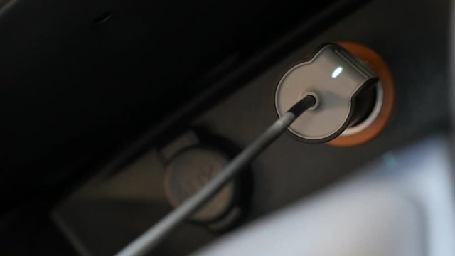Connecting USB phone charger on car lighter socket 4K video