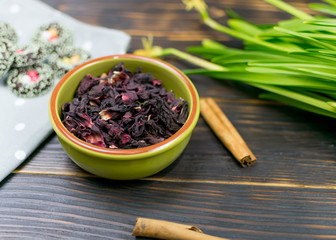 Hibiscus thea from rose carcade on a dark background.