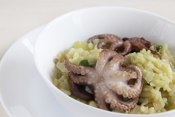 Rice with mini octopuses and green peas