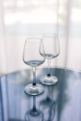 Two empty glasses on the table. Hotel
