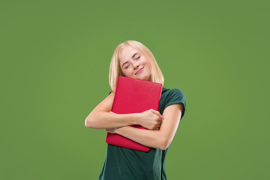 Businesswoman hugging laptop. Love to computer concept. Attractive female half-length front portrait