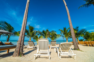 Umbrella and chair around beach and sea for travel and vacation