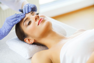 Obraz na płótnie Canvas Skin Care Skin Procedures. Beautiful Young Woman in Spa Salon. Lying on Massage Tables and Relax. High Resolution