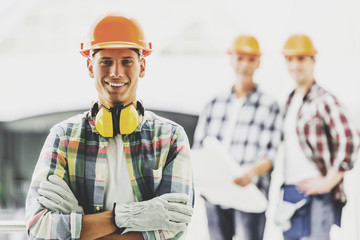 Smiling Industrial Engineers in Shirts and Helmets