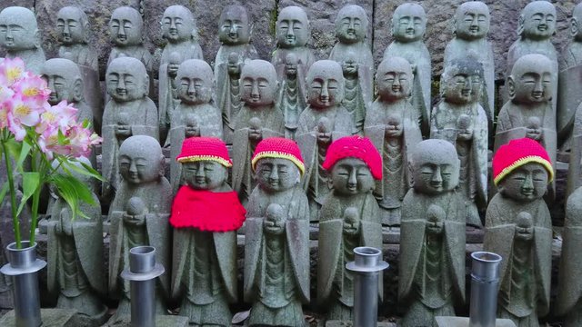 Army of praying monk statues at Hase Dera Temple in Kamakura - TOKYO / JAPAN - JUNE 12, 2018