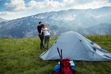 Couple enjoying at camping near the tent