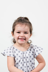 Adorable child little girl on studio white background