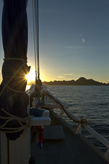 The ocean view from the bow of a sailing ship on the beautiful sunsets