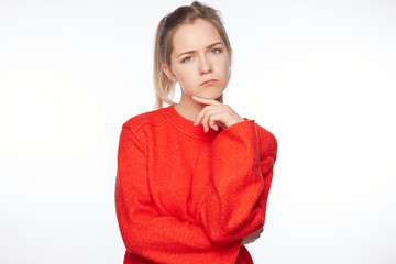 Human emotions, reaction and attitude. Attractive lady in casual sweater frowning face and keeping...