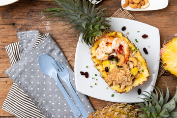 Fried rice with seafood served in a pineapple