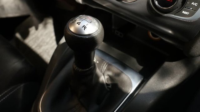 Shifting gears in car with hand slow-mo footage