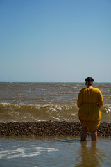 Fototapeta na wymiar Woman standing by the sea