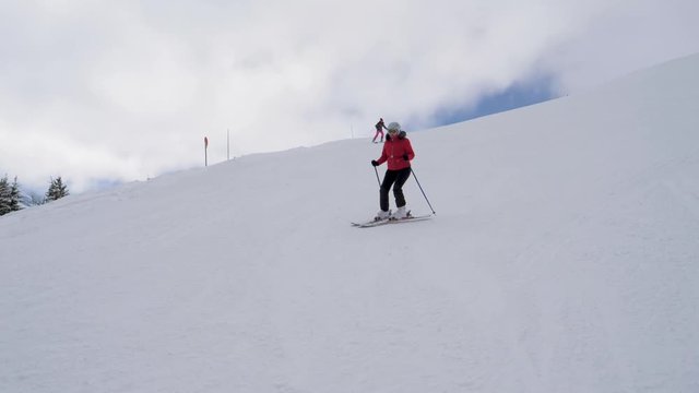 Skiers Skiing On The Difficulty Mountain Downhill In Winter Ski Resort