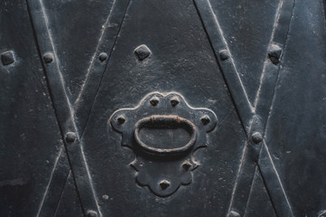 part of metal doors with texture, plates and rivets
