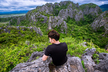 Naklejka premium Tourists climb the natural view (Khao Daeng viewpoint) 360 degree natural scenery located in Prachuap Khiri Khan, Thailand.