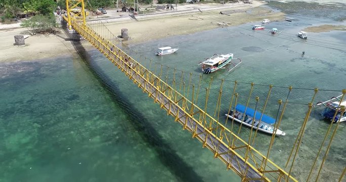 Aerial drone view of Yellow Bridge connecting Nusa Lembongan with Ceningan in Bali, Indonesia
