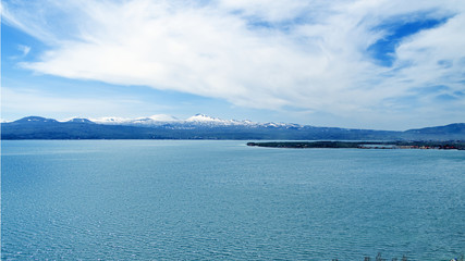 Lake Sevan in Armenia, beautiful view of lake on a sunny bright spring day, beautiful clouds