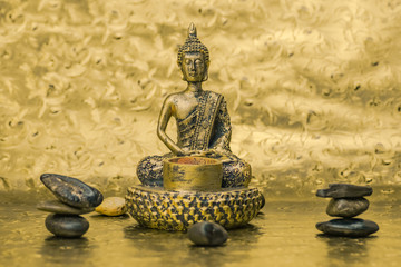 golden buddha on a golden background