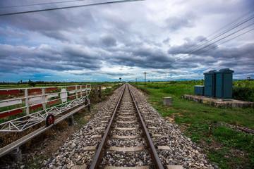 Fototapeta na wymiar Railroads have barricades and traffic signals to alert when trains pass.