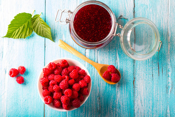 raspberry berry jam fresh  sweet berry wooden art background
