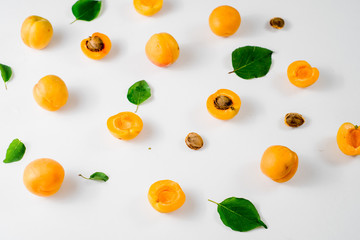 Many apricots on the white background. Top view